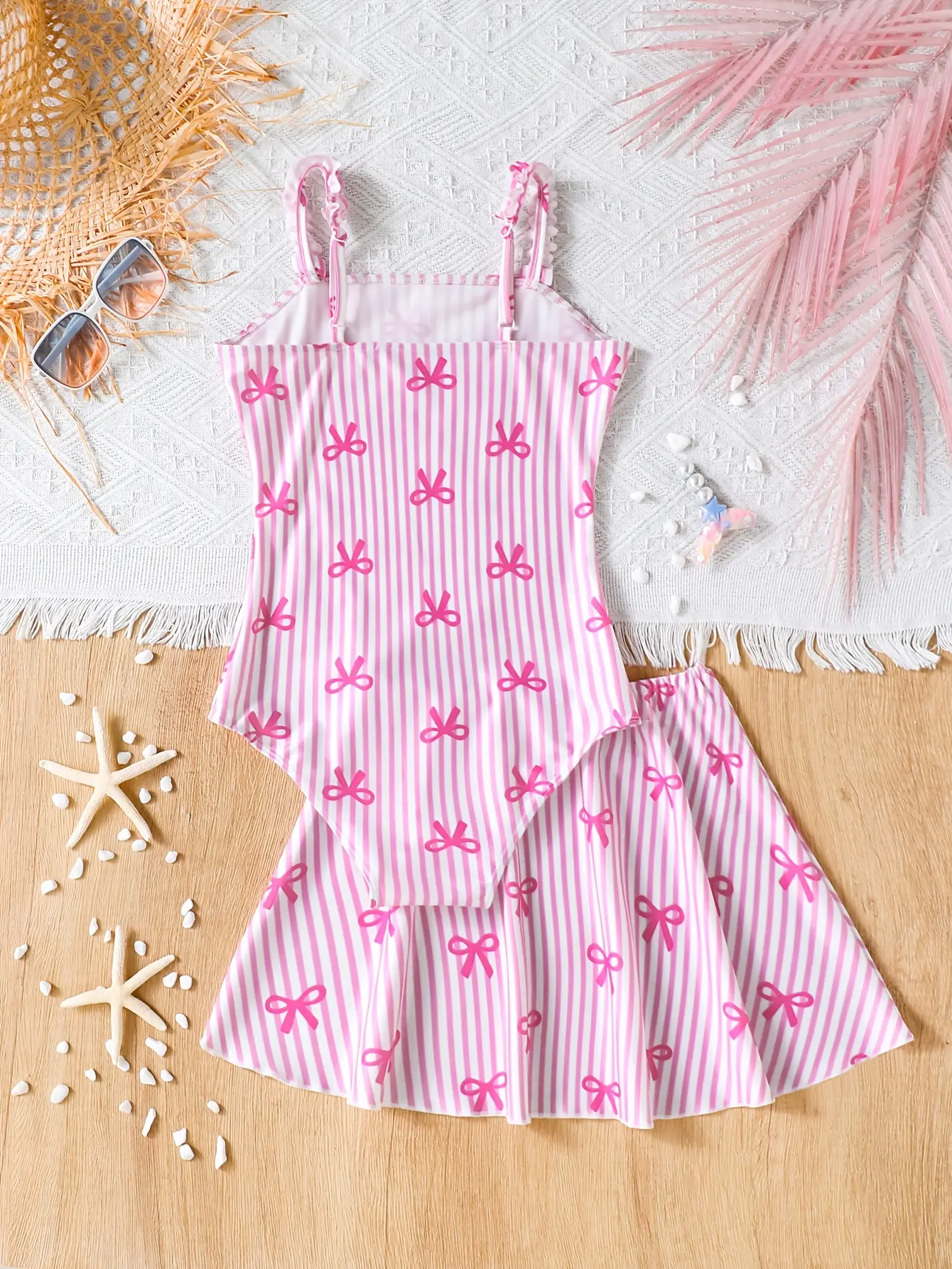 Detail view of Girls Pink Bow Stripe One-Piece Swimsuit with Skirt by LUNORIANA