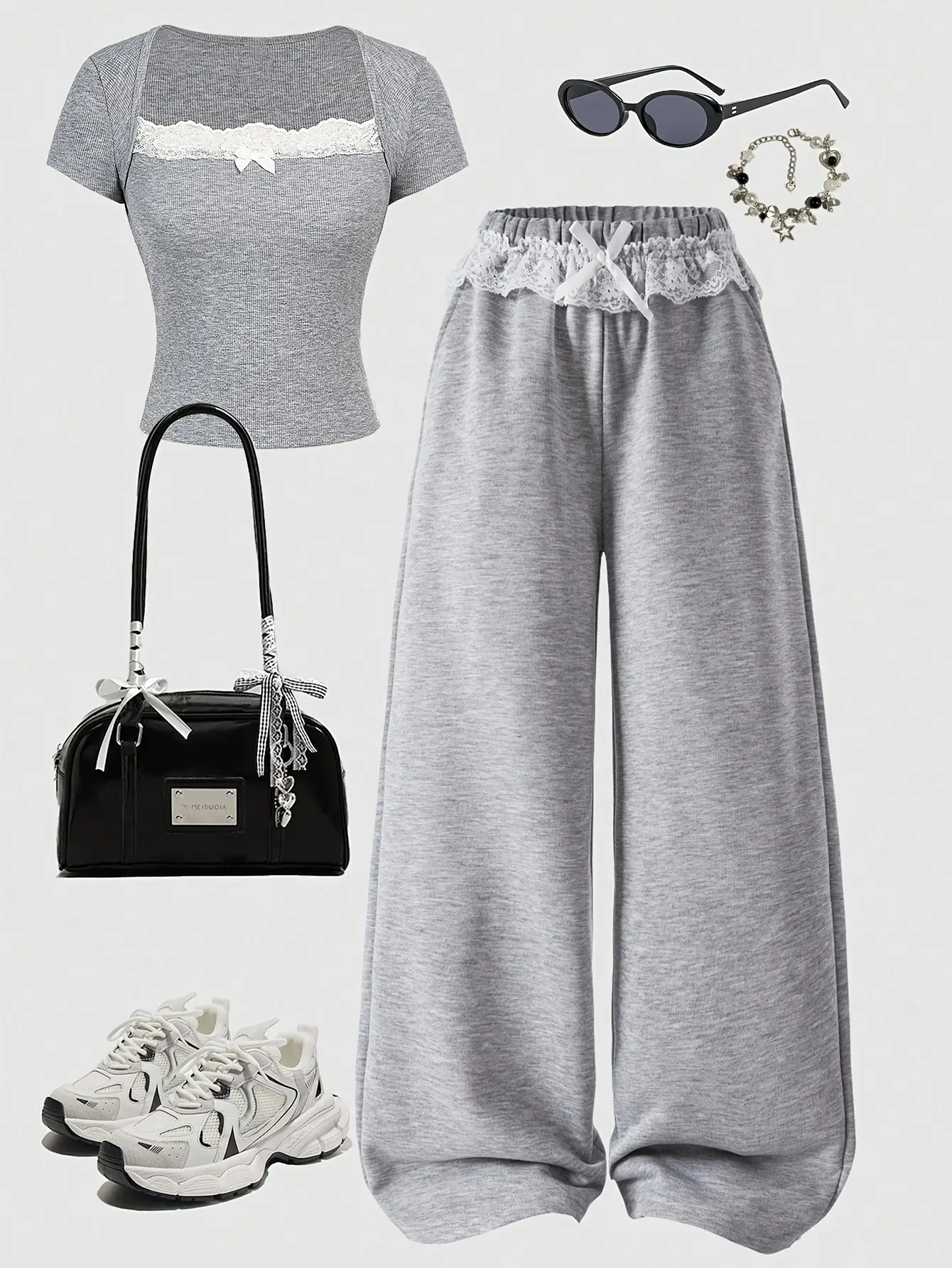 Detail view of Girls Fitted T-Shirt and Sweatpants 2-Piece Set with Bow Detail by LUNORIANA