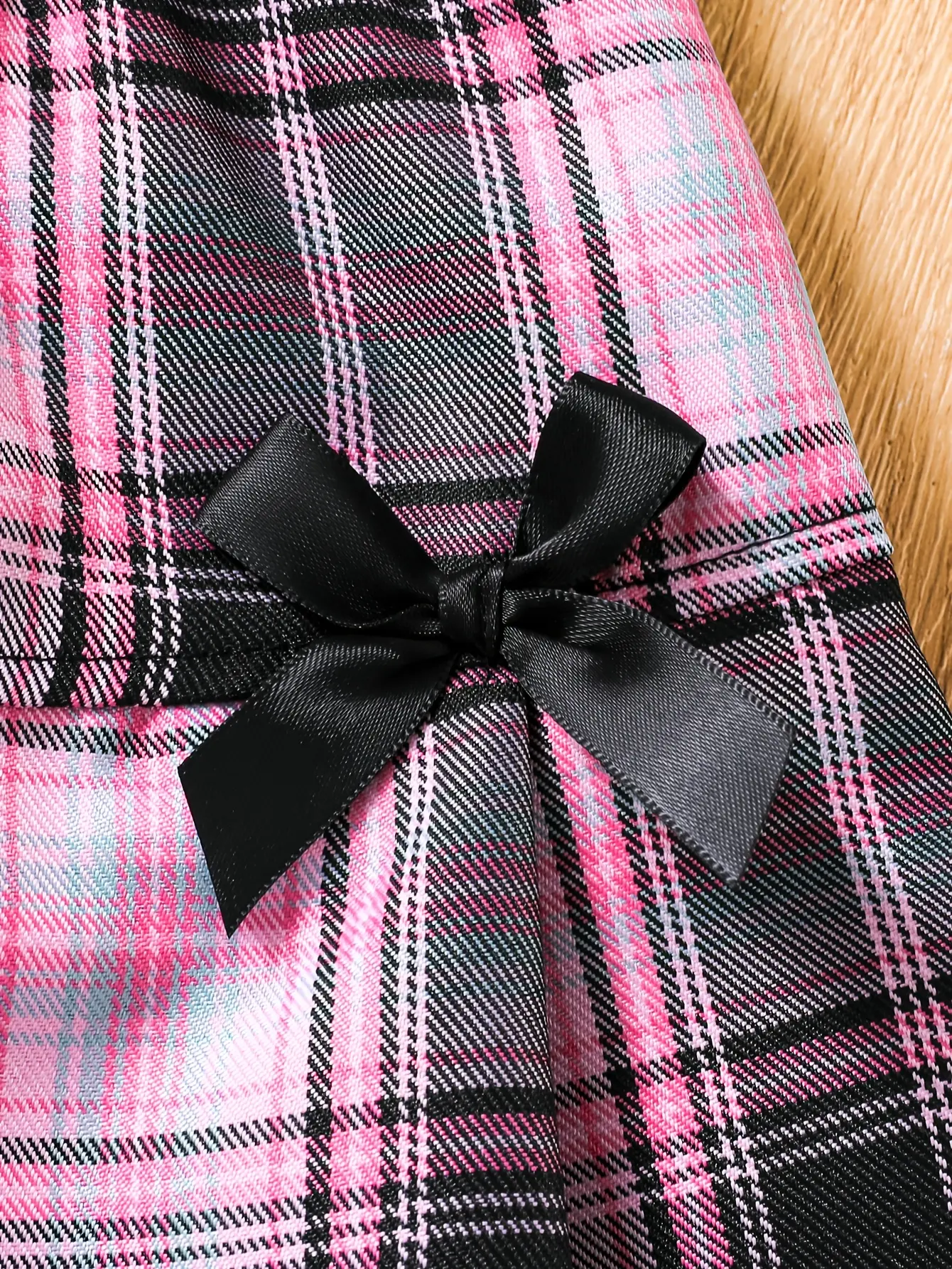 Detail view of Girls Short Sleeve Shirt and Plaid Bow Skirt Set by LUNORIANA