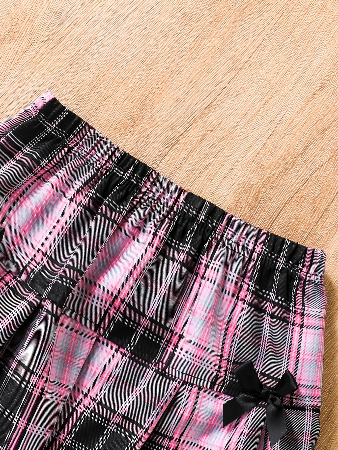 Detail view of Girls Short Sleeve Shirt and Plaid Bow Skirt Set by LUNORIANA