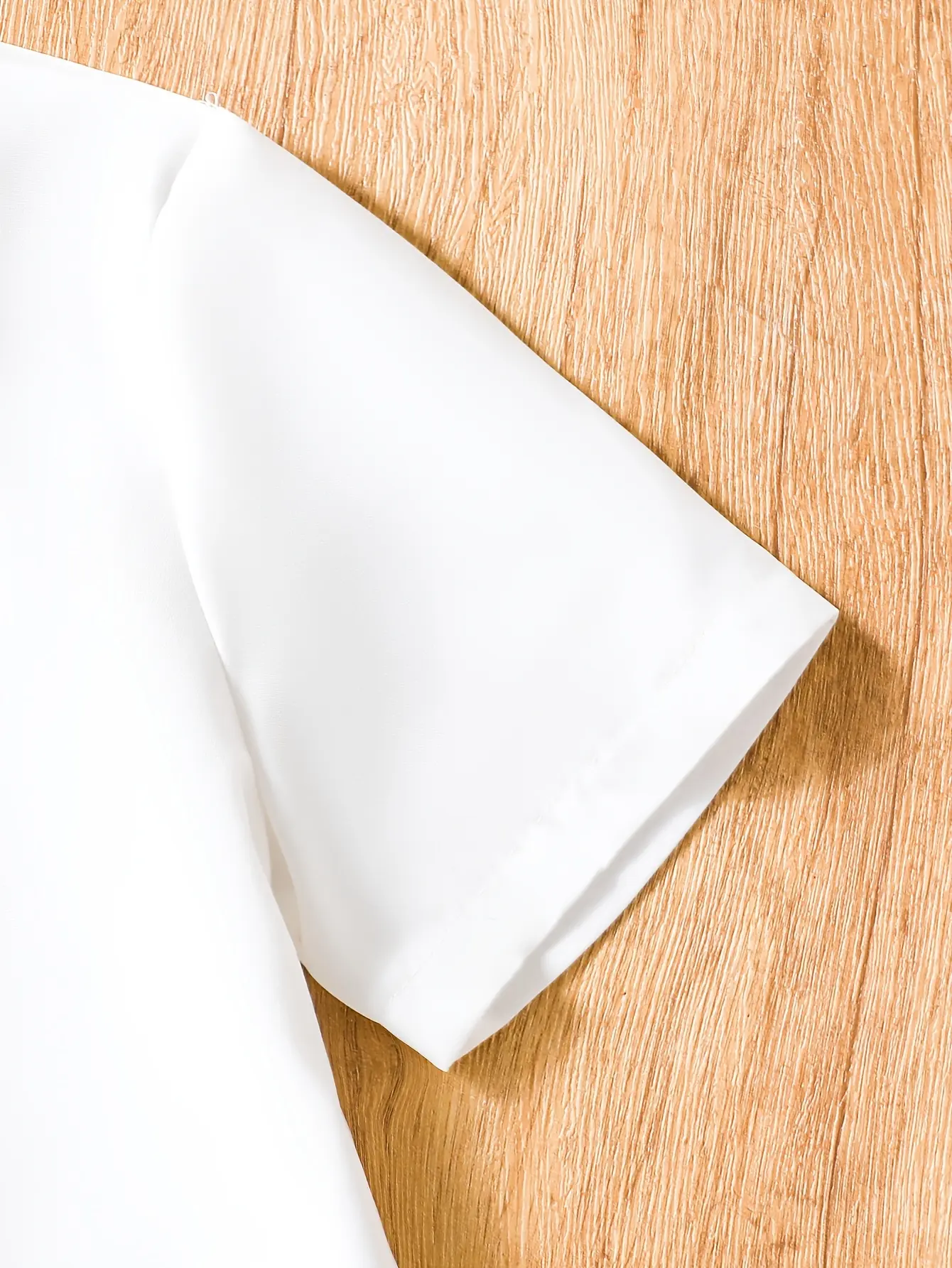 Detail view of Girls Short Sleeve Shirt and Plaid Bow Skirt Set by LUNORIANA