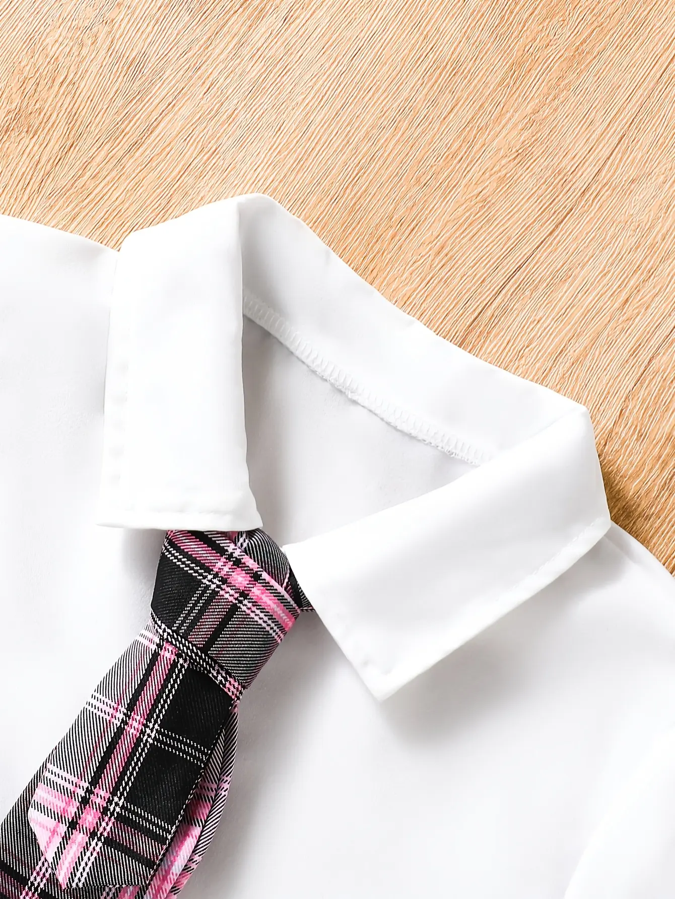 Detail view of Girls Short Sleeve Shirt and Plaid Bow Skirt Set by LUNORIANA