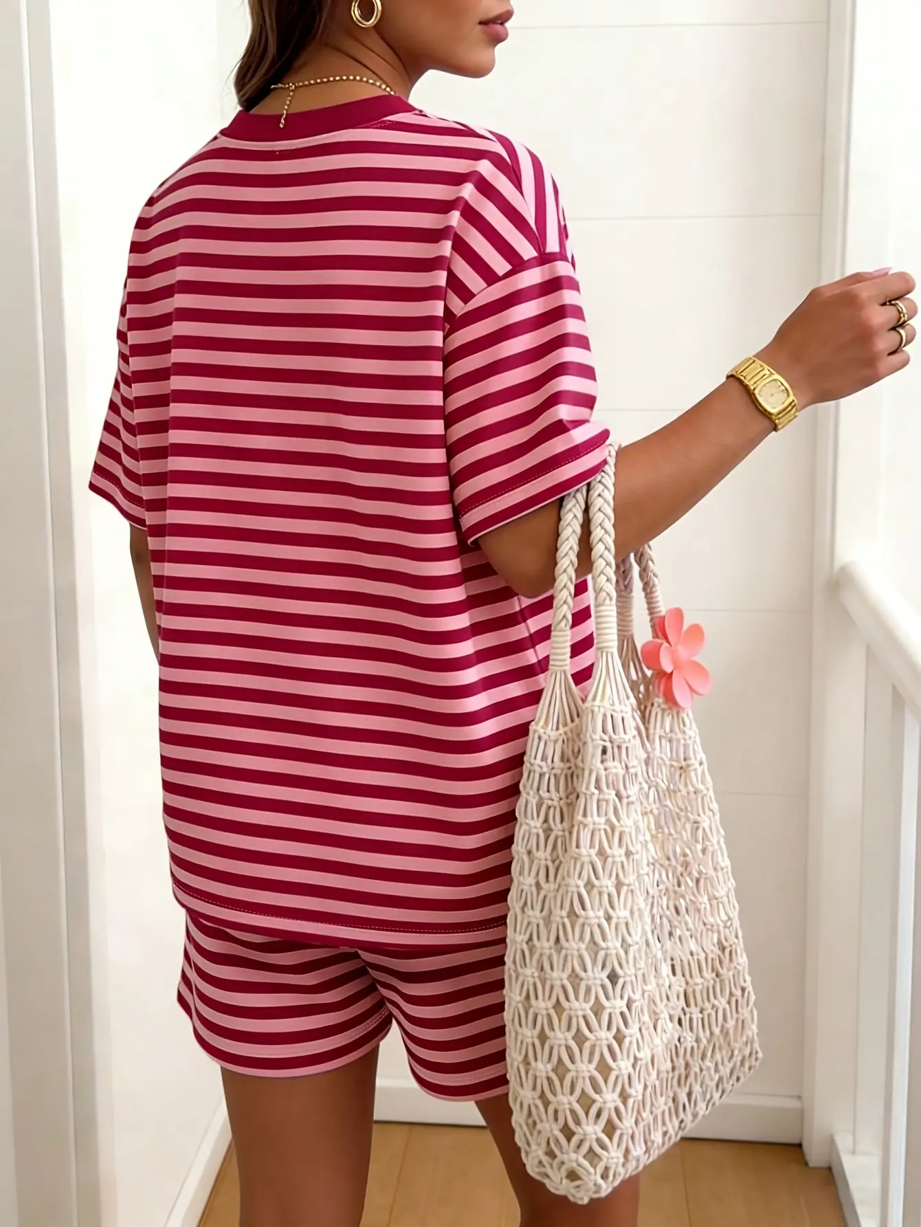Back view of red and pink striped T-shirt and shorts set