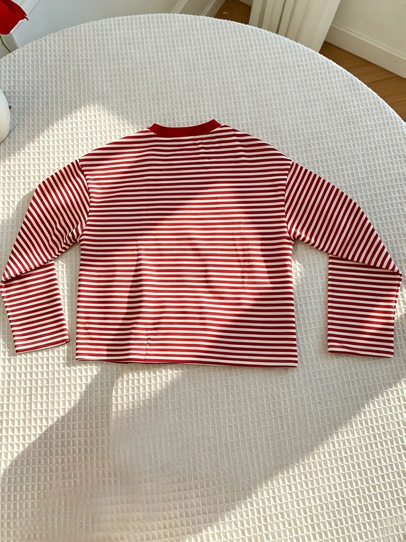 Women’s red striped drop-shoulder T-shirt flat lay