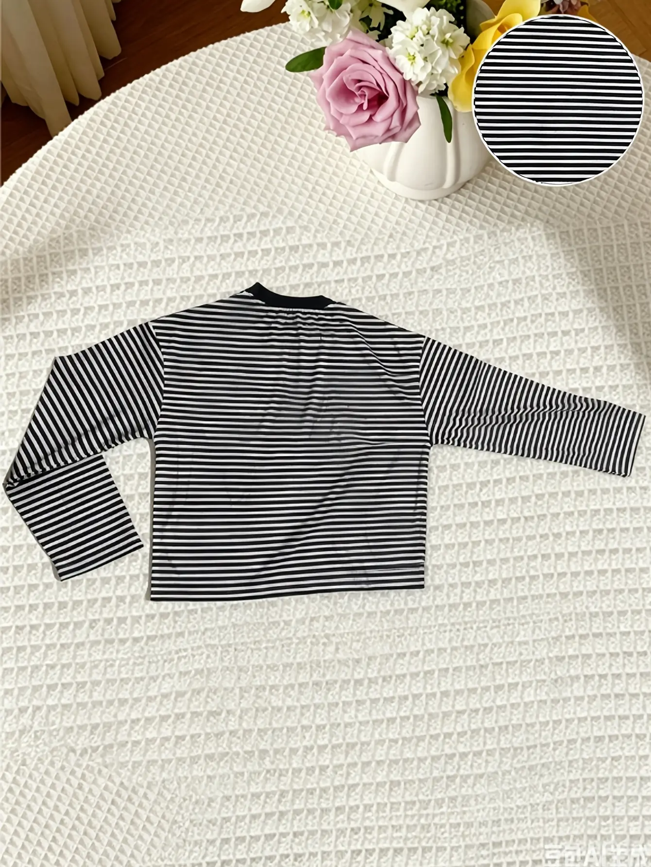 Women’s black striped drop-shoulder T-shirt flat lay