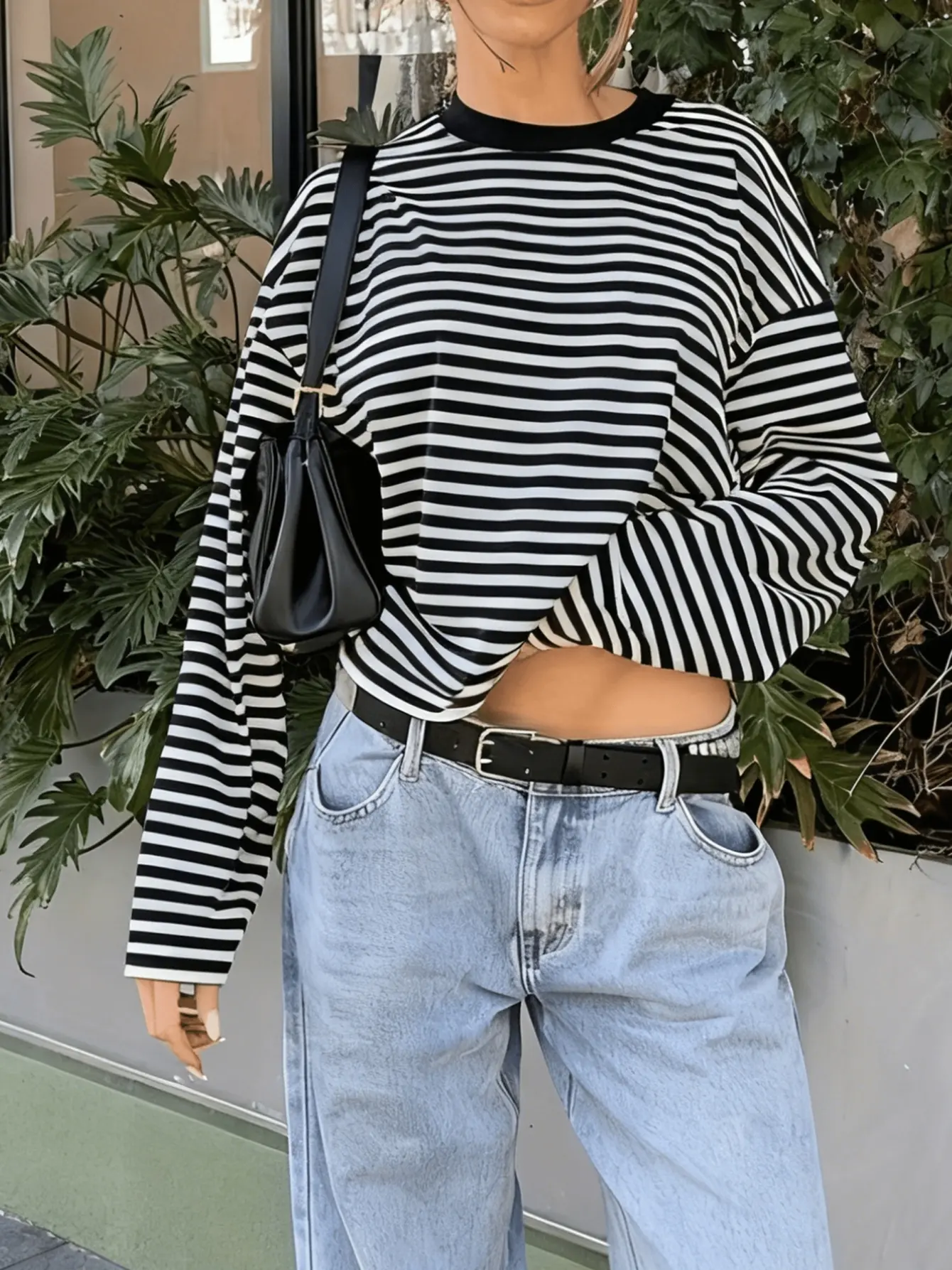Women’s black striped drop-shoulder T-shirt on model