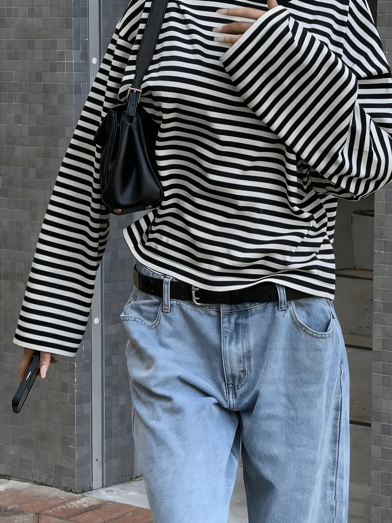 Women’s black striped drop-shoulder T-shirt back view