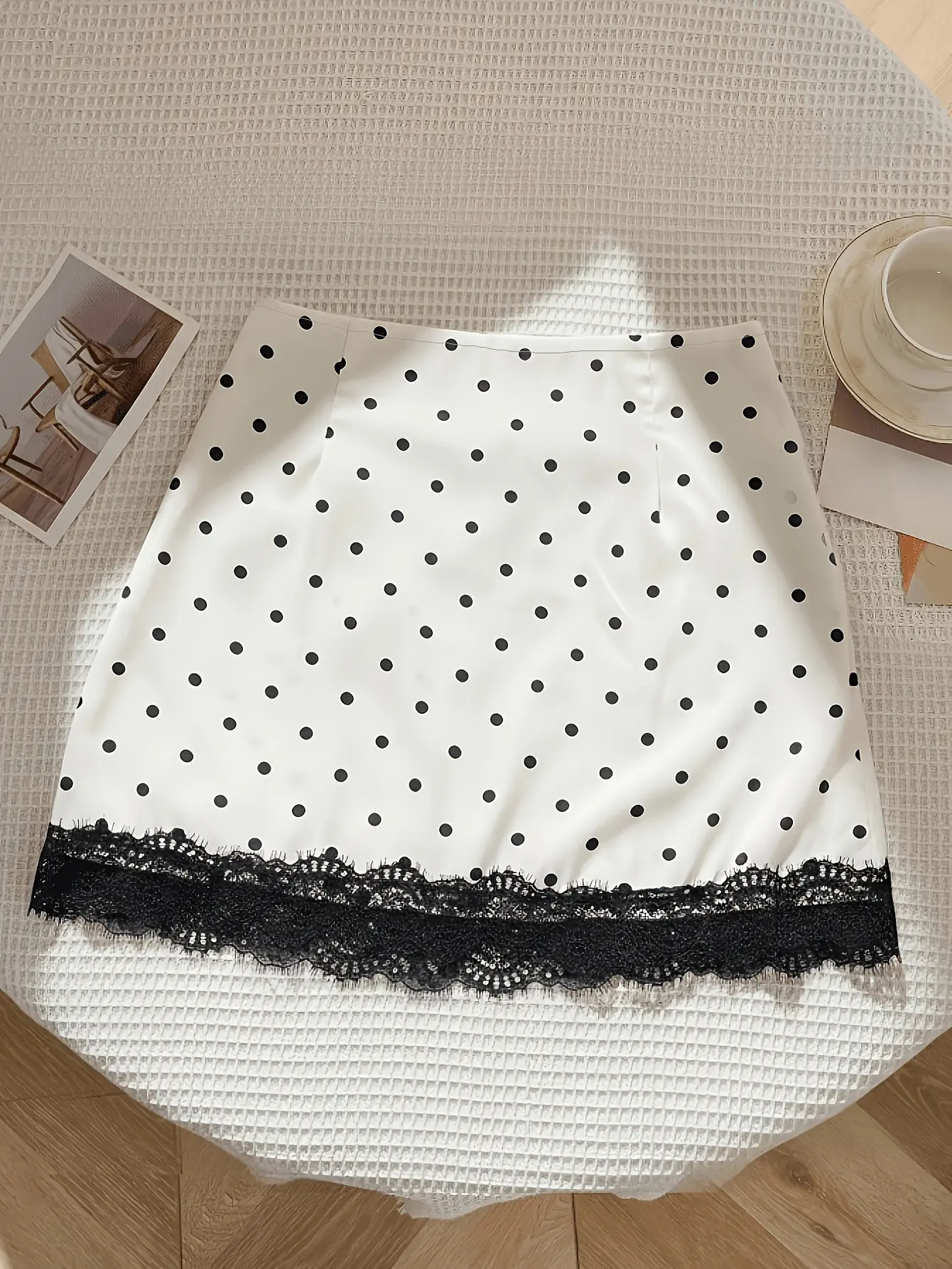 White polka-dot skirt with black lace trim