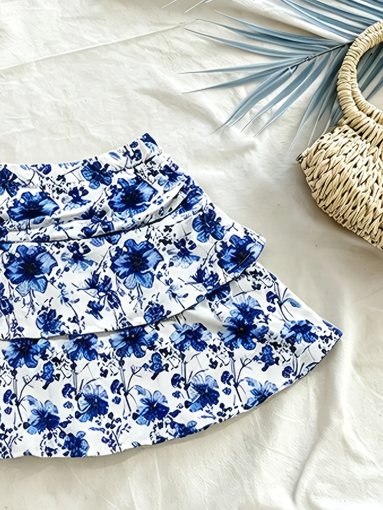 Women’s blue floral ruffle-tiered mini skirt detail