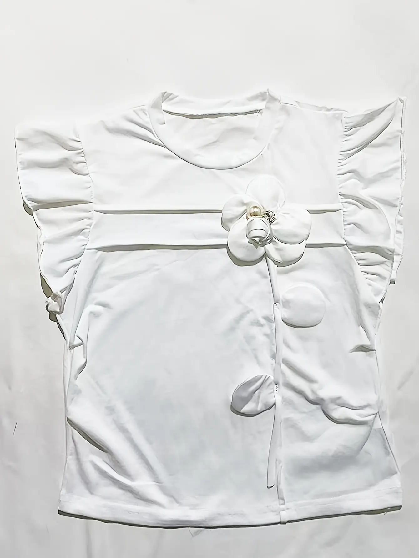 White ruffle-sleeve top with floral applique
