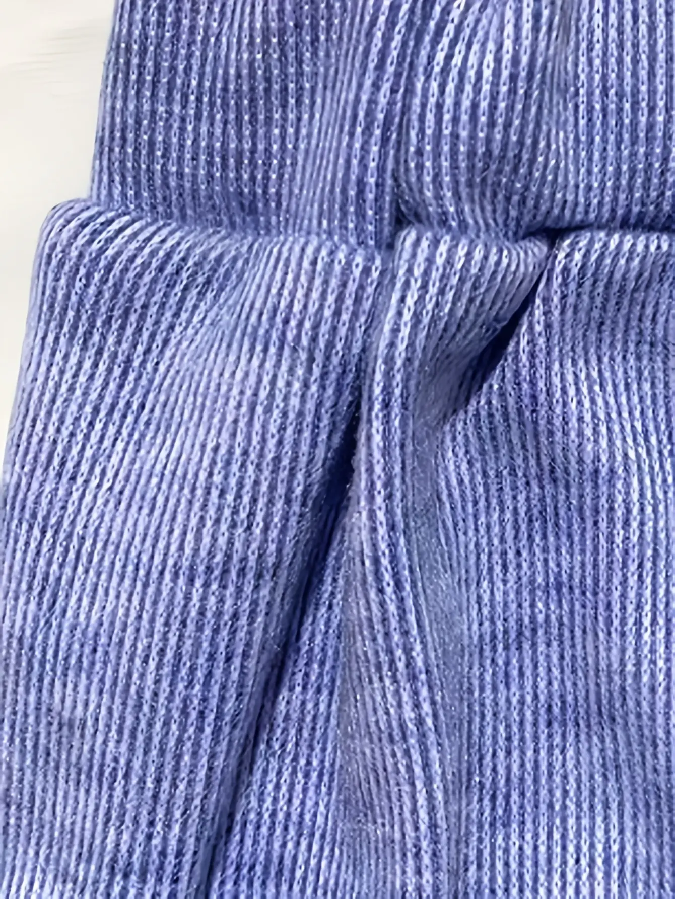 Close-up of blue ribbed knit fabric