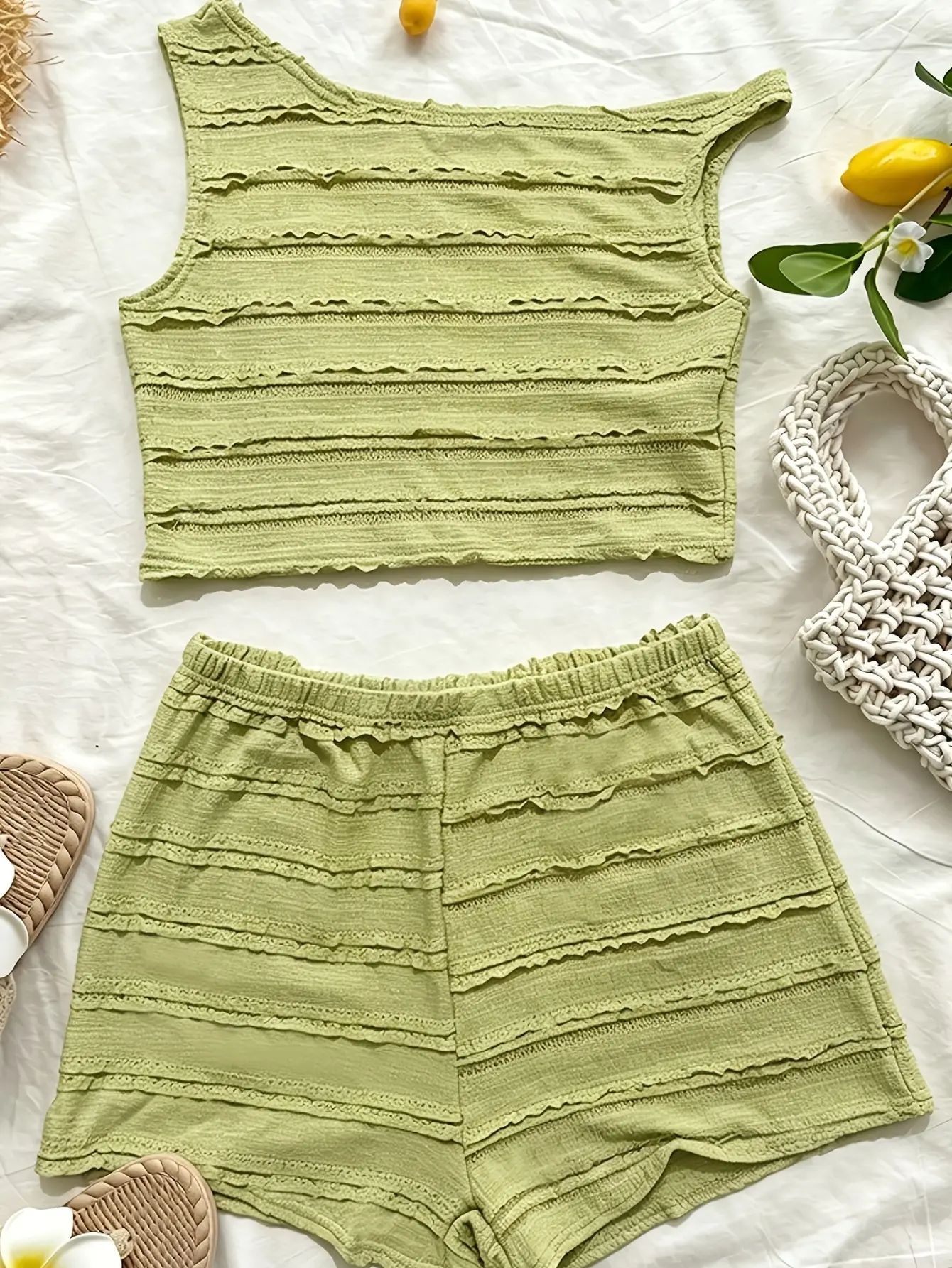 Green knit shorts from asymmetric top and shorts set